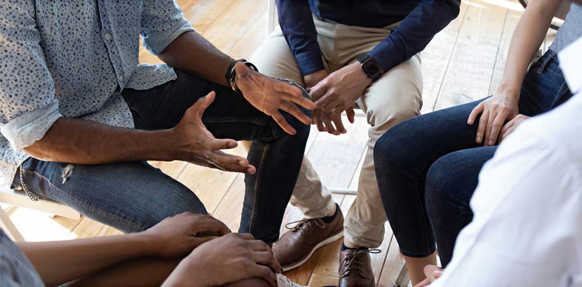 Man sharing his story with small group